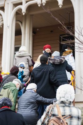 crowd walking up the steps and entering drayton house 